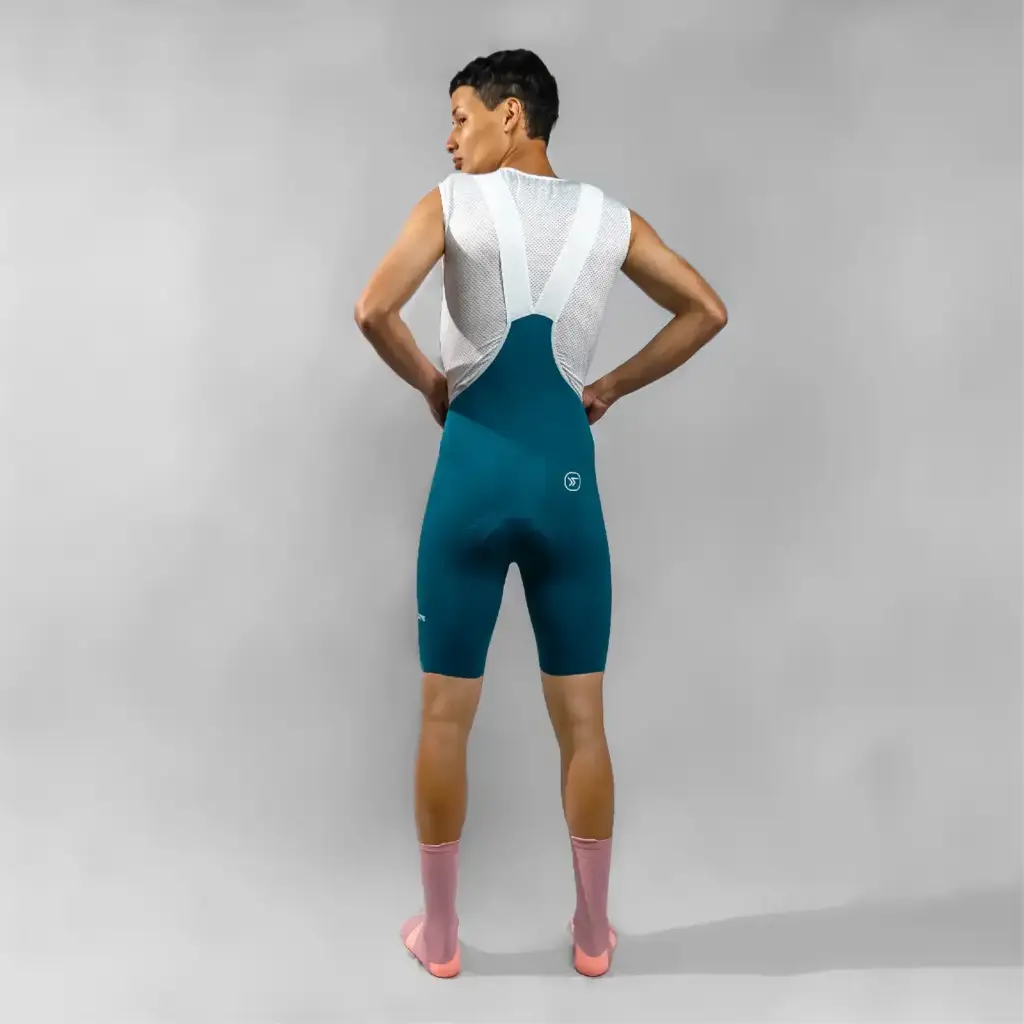 3.-UNIFORME-DE-CICLISMO-BIB-SHORST-TEAL-HOMBRE-PANTALONETA-DE-CICLISMO-TEAL-CAPOTE-LICRA-DE-CICLISMO-ESPALDA-CAPOTE-jpg